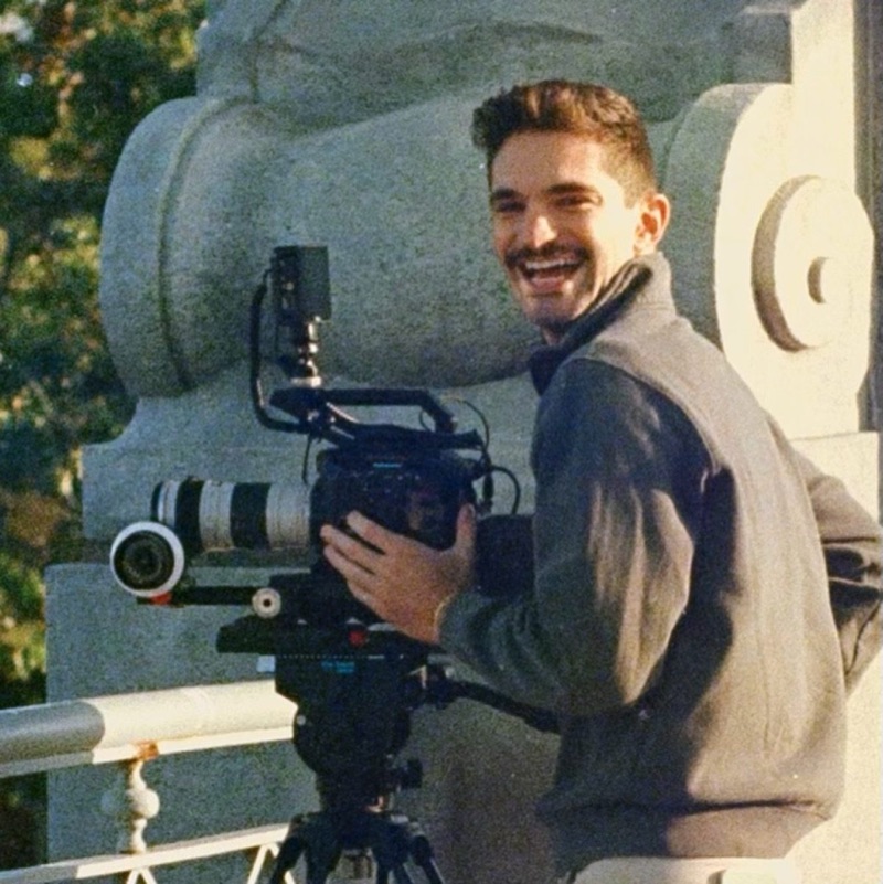 Michael Rotiroti smiling behind a cinema camera on set